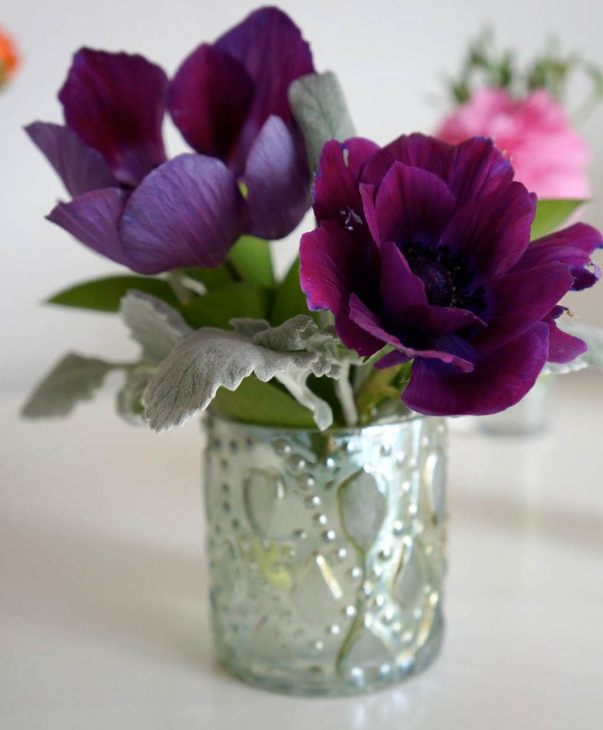 poppy flower arrangements in metallic vase