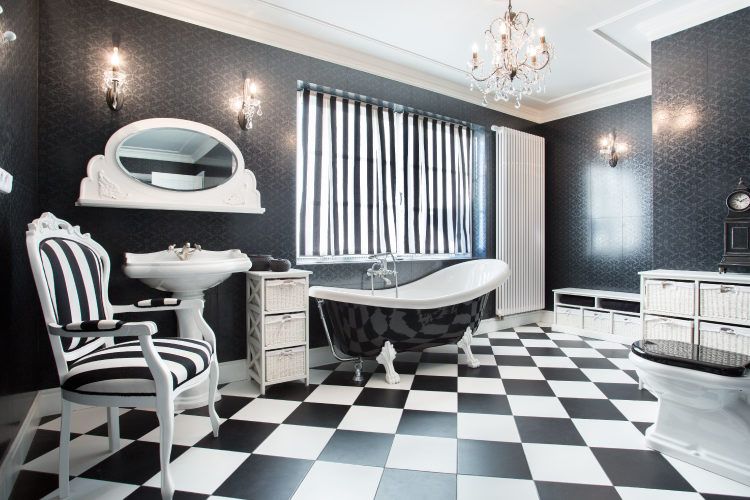 Throw in a chair and rug to keep your partner company when s/he's in the tub. Bathroom decorating tips_additional seating