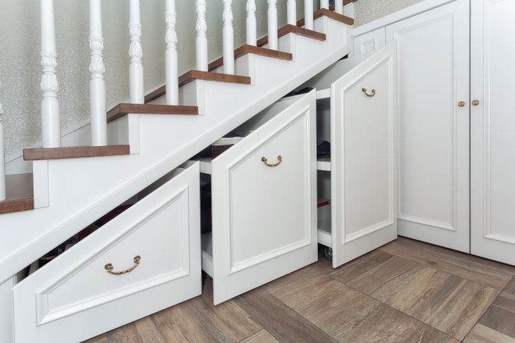 10 Decorating And Storage Ideas For The Space Under Your Stairs