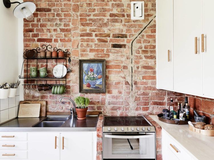 exposed brick wall in rustic kitchen