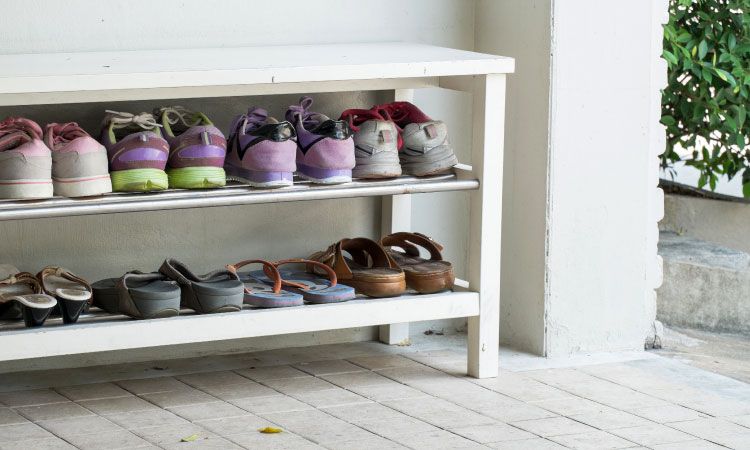 https://jumanji.livspace-cdn.com/magazine/wp-content/uploads/2017/07/27163553/dry-home-entrance-monsoons-open-shoe-rack.jpg