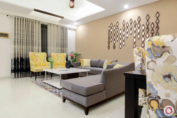 a-living-room-with-a-yellow-couch-and-yellow-chairs