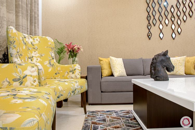a-living-room-with-yellow-and-grey-furniture