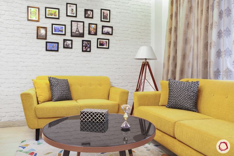 photograph-wall-decor-yellow-sofa-textured-wall-living-room