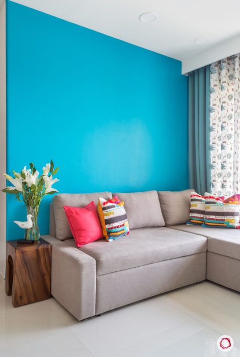 Goregaon home design-blue wall-neutral sofa