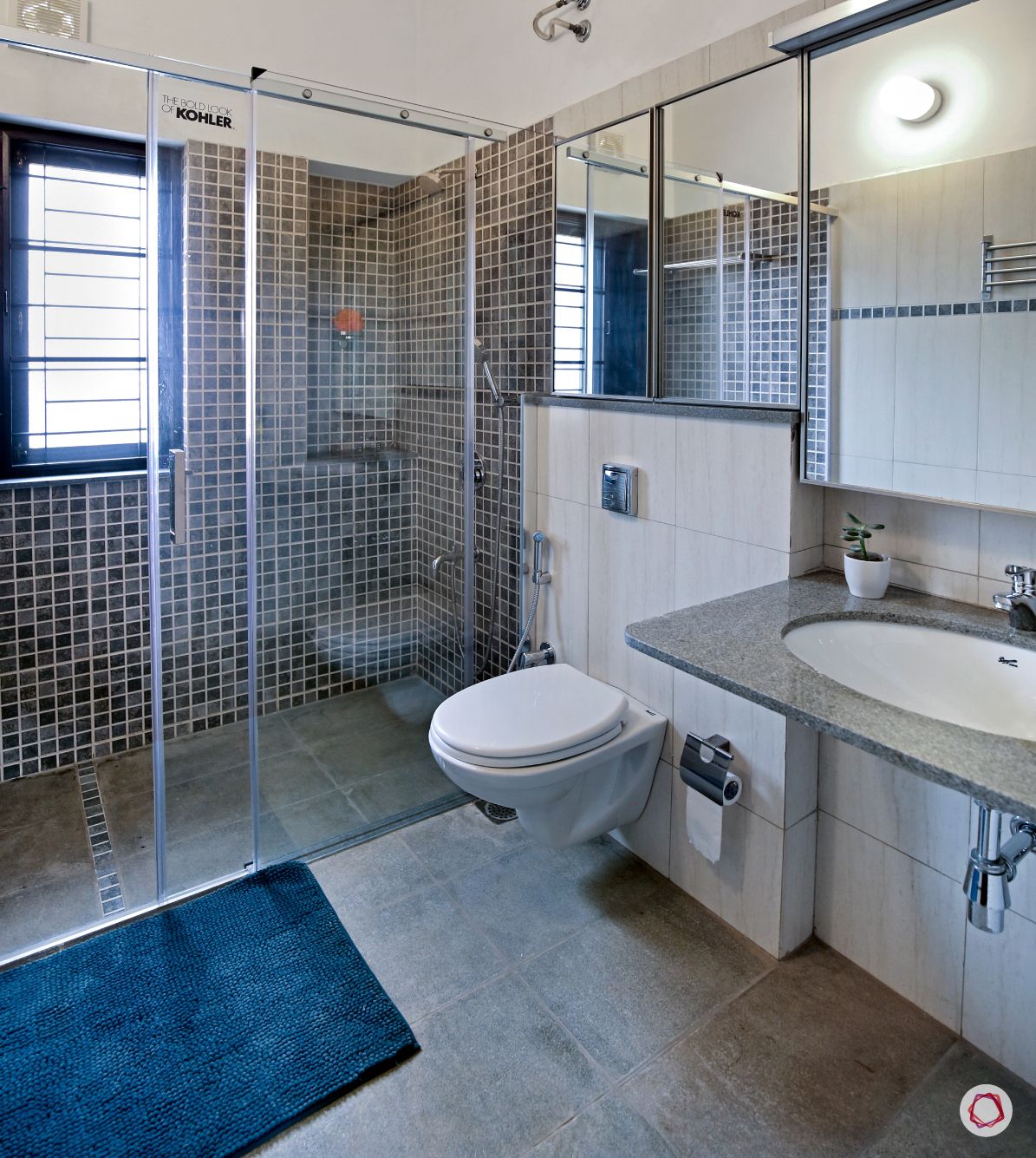 mosaic-wall-tiles-bathtub-toilet-white-blue-mirror-sink