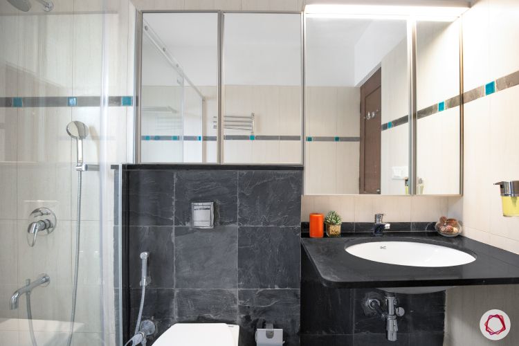 shower-cubicle-mirror-cabinets-black-countertop-sink