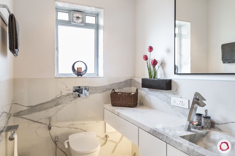 minimal-white-marble-toilet-sink-flowers-mirror