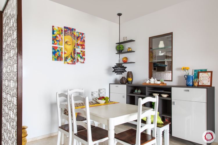 white-dining-table-with-white-storage-modem-colourful-wall-art