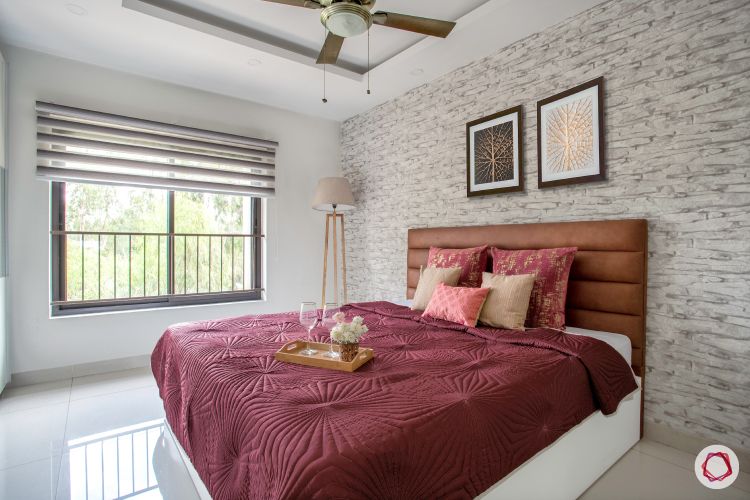 blinds-neutral-strip-bedroom-brown-headboard-brick-wall-maroon-sheet
