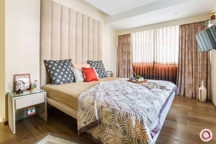 bedroom-fabric-headboard-side-table-wooden-flooring-vase