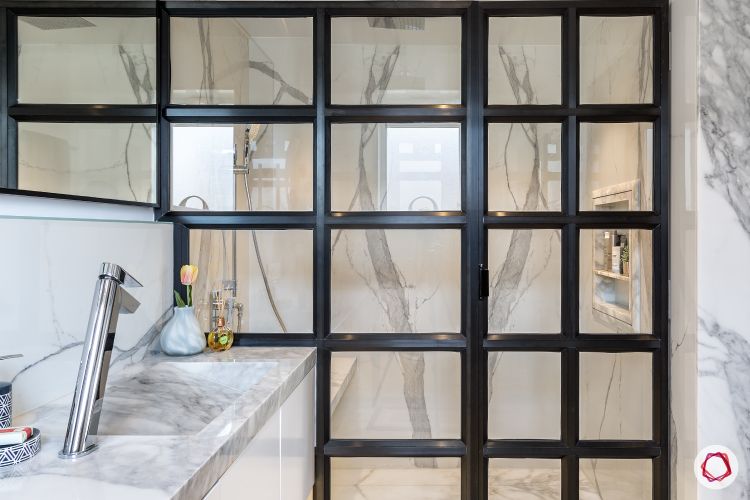 Bathroom-glass partition-marble tiles-sleek