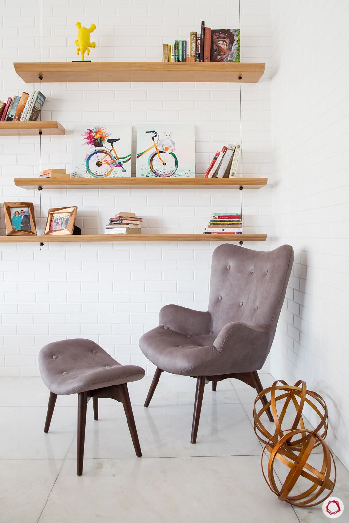 Alia Bhatt-reading corner-wooden shelves-exposed brick wall-accent chair