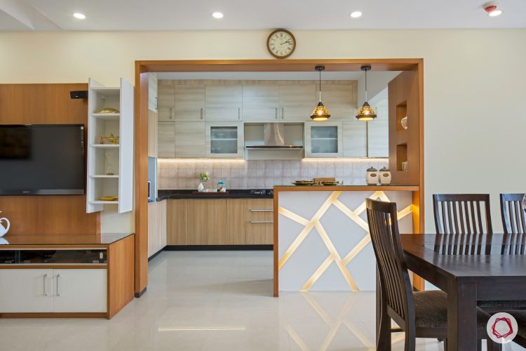 interior open kitchen with breakfast counter, pendant lights and all wood framework