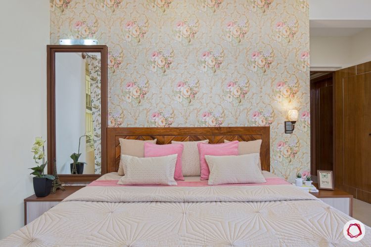 interior floral wallpaper and wooden headboard