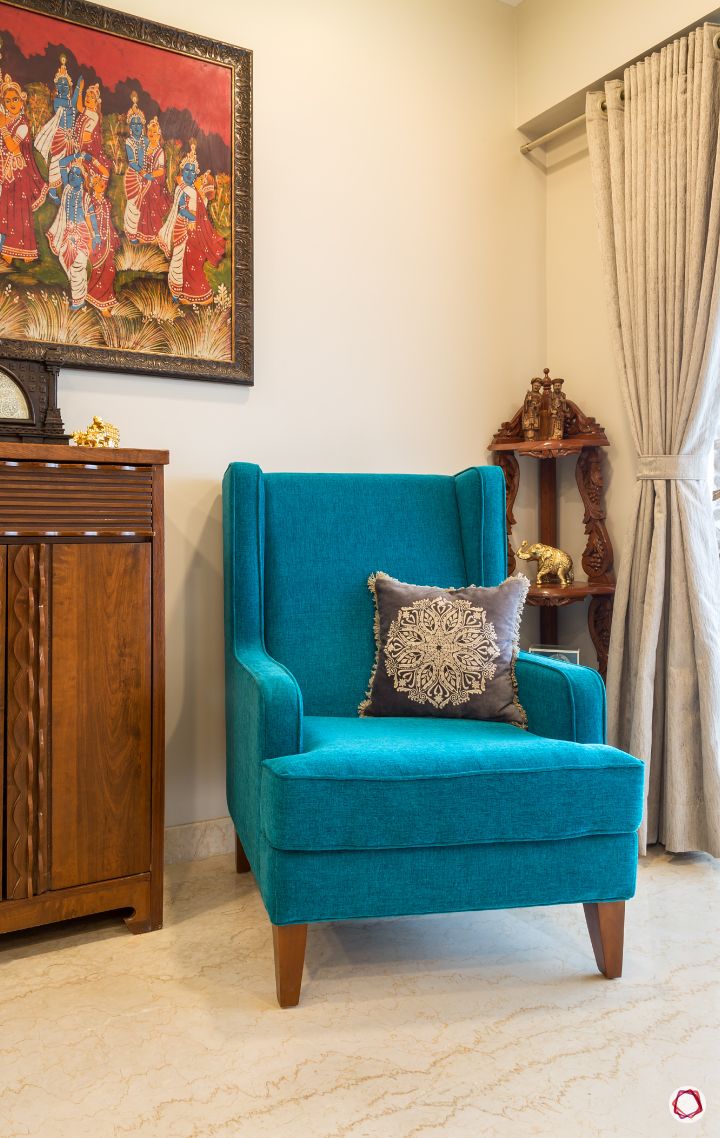 blue-armchair-in-a-wooden-antique-living-room