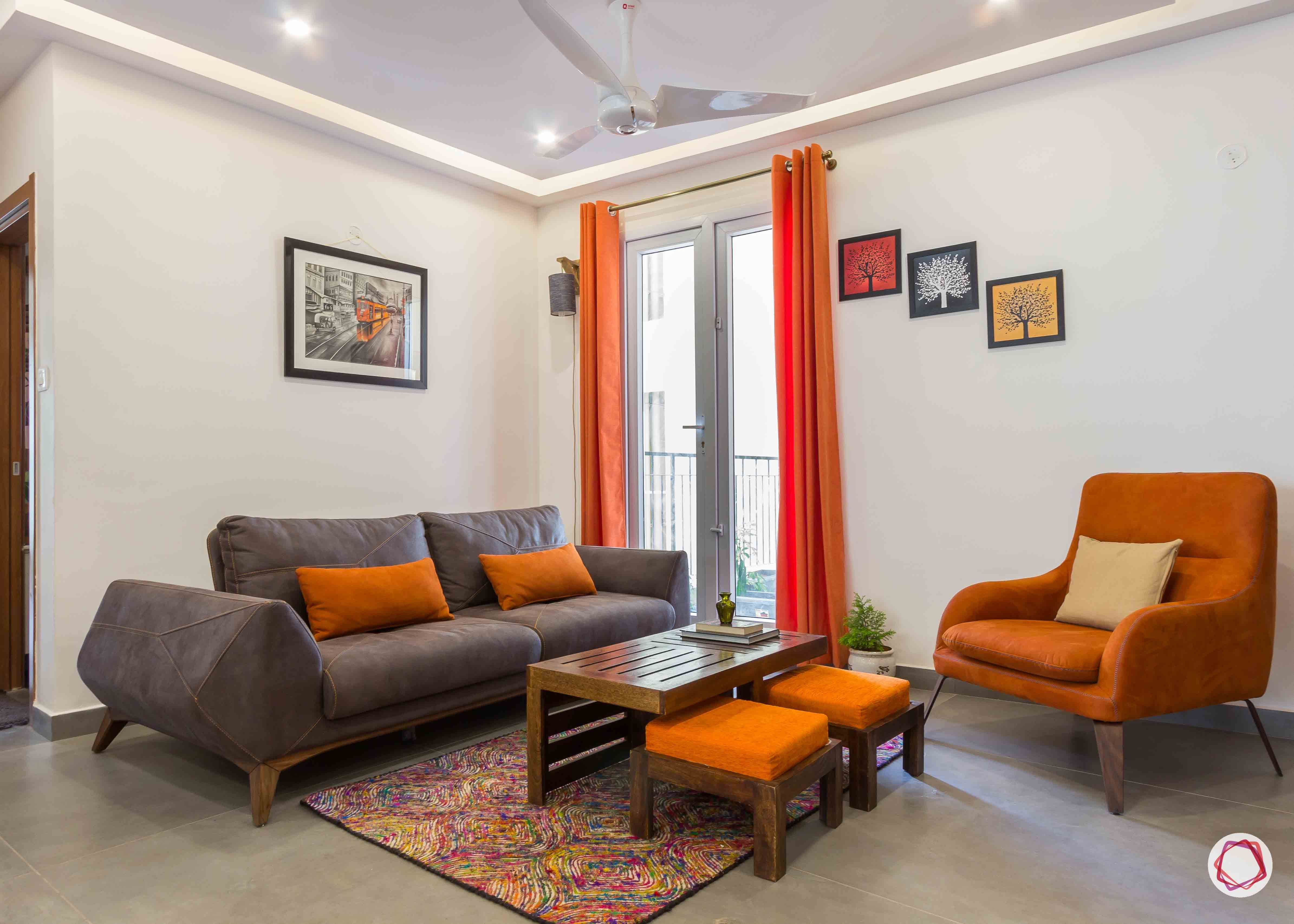 Best interior designers in bangalore_orange-armchair-pillows-sofa