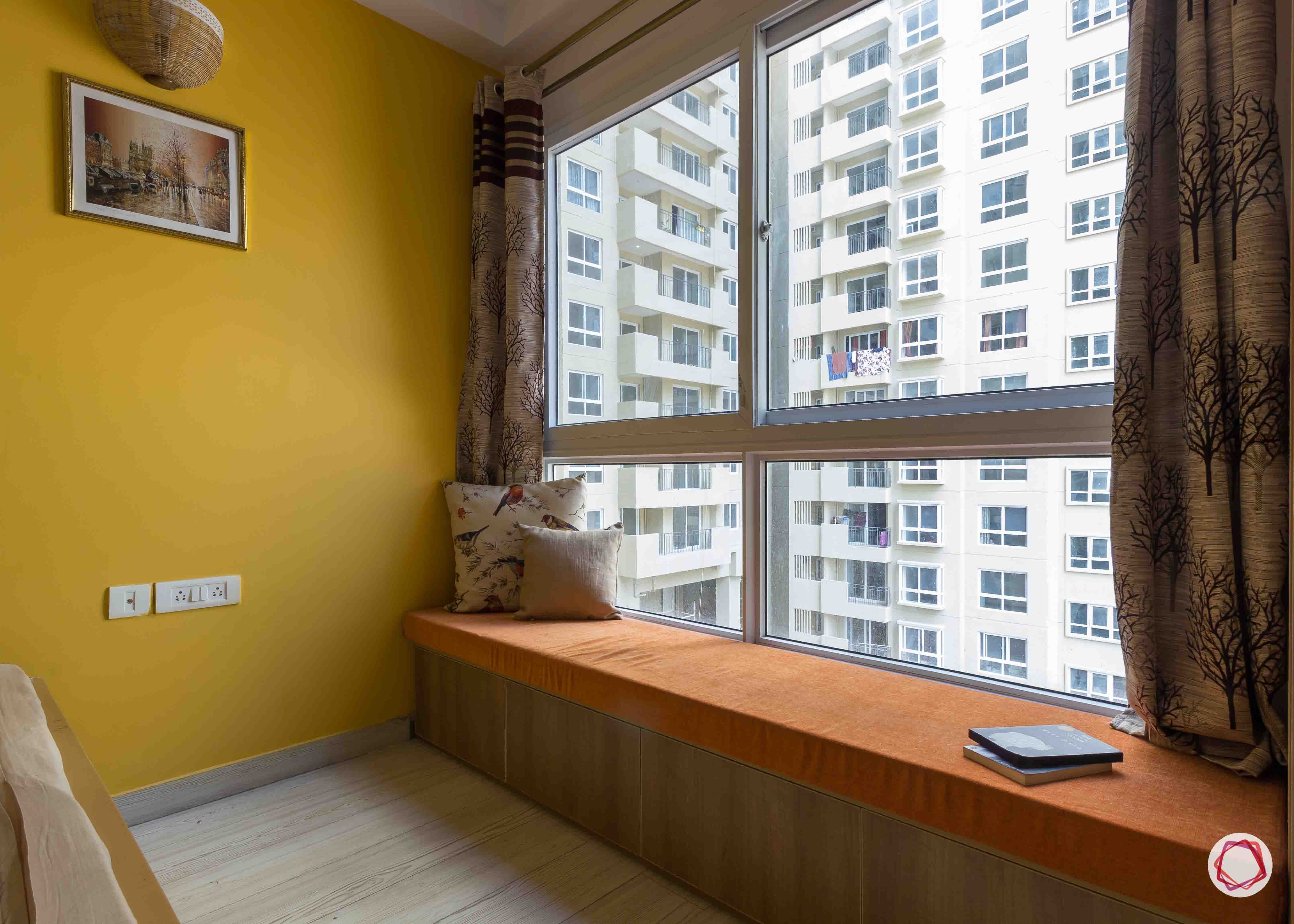 Best interior designers in bangalore_window-seat-yellow-wall