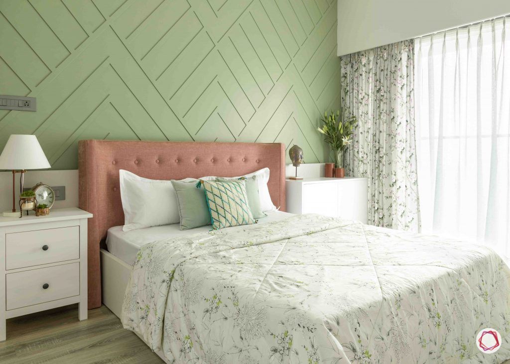 painting ideas-pastel accent wall-textured paint-bedroom-headboard-white cabinets-sea green room