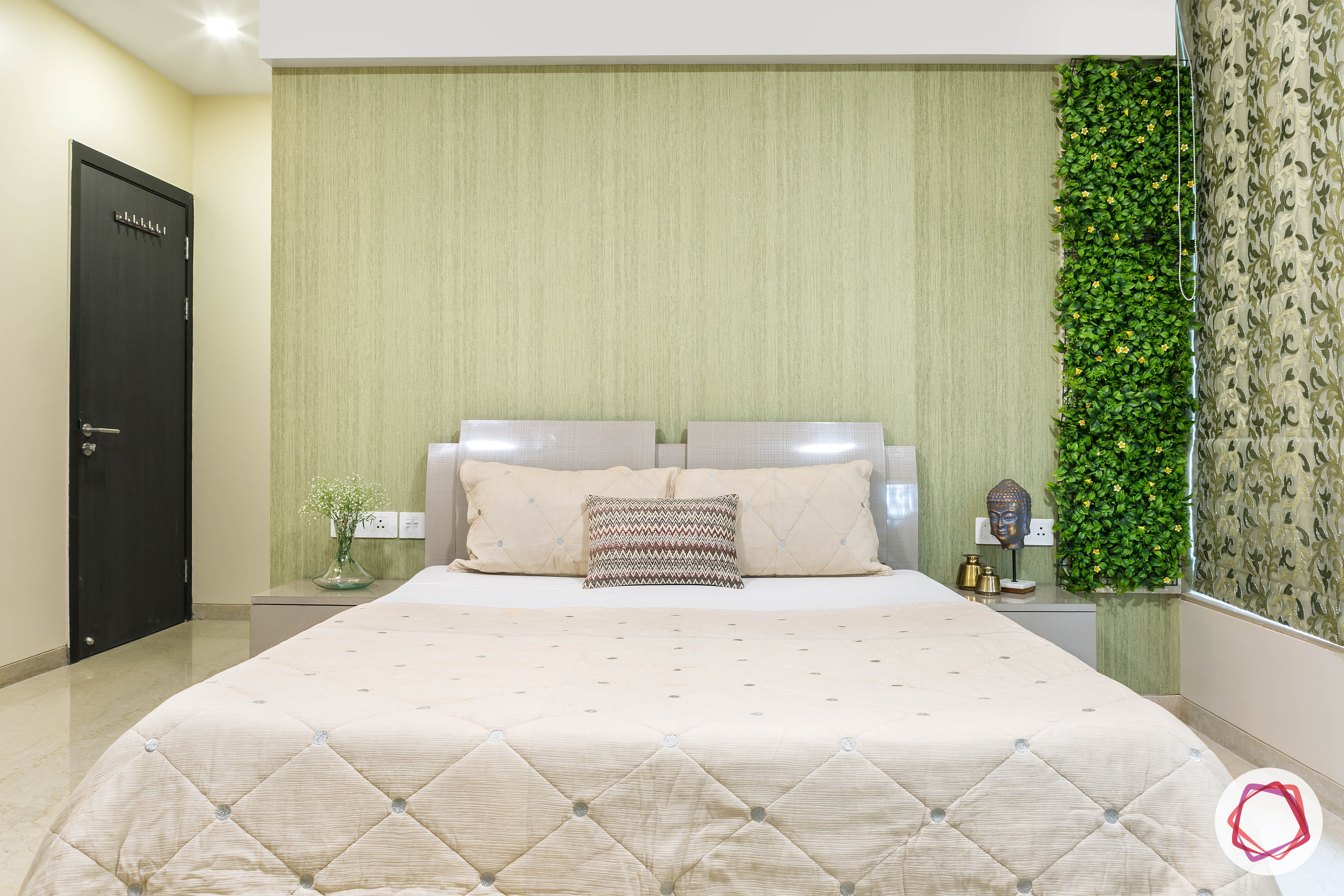 Oberoi esquire_master bedroom bed and vertical garden
