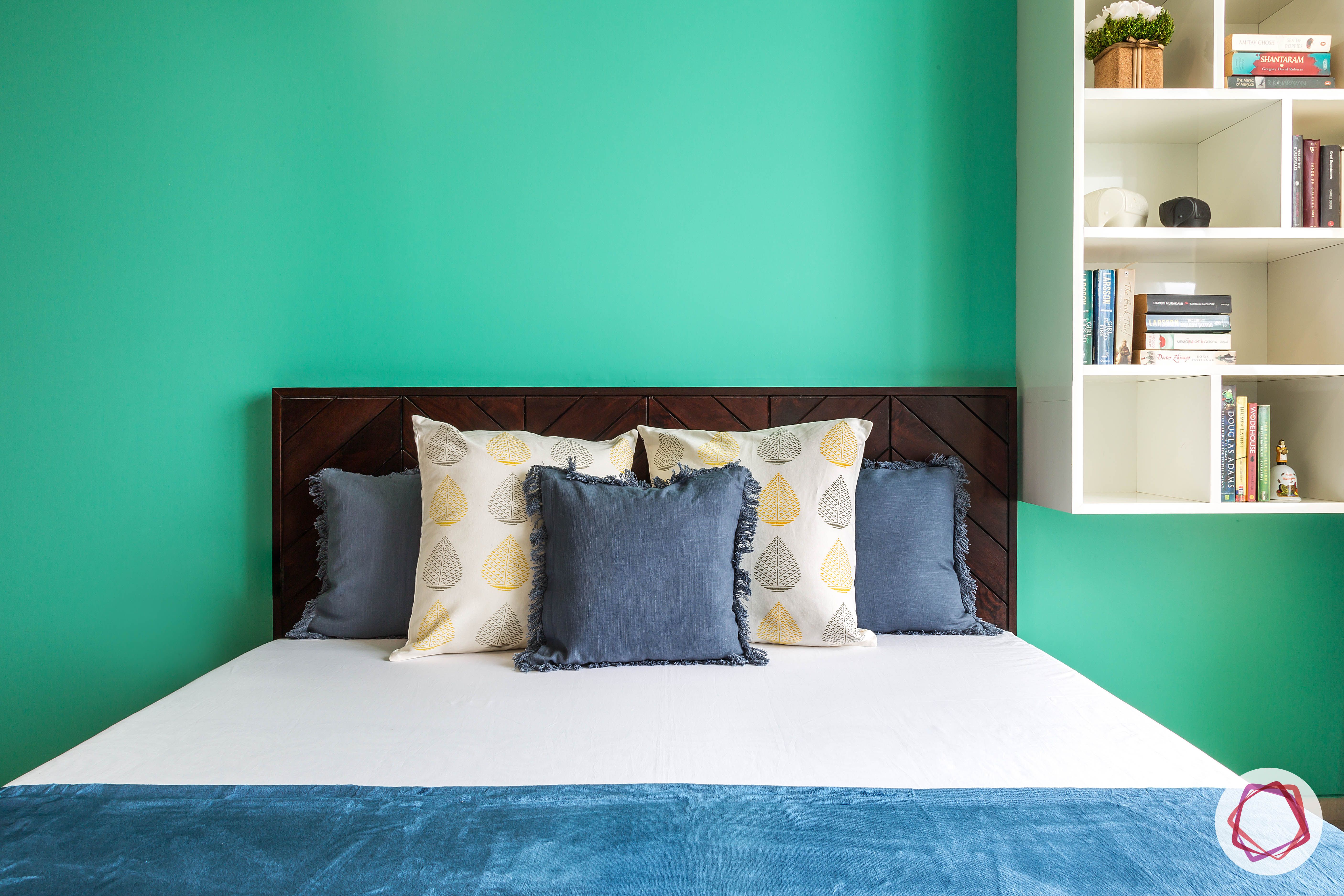 Oberoi esquire_daughters bed and teal wall