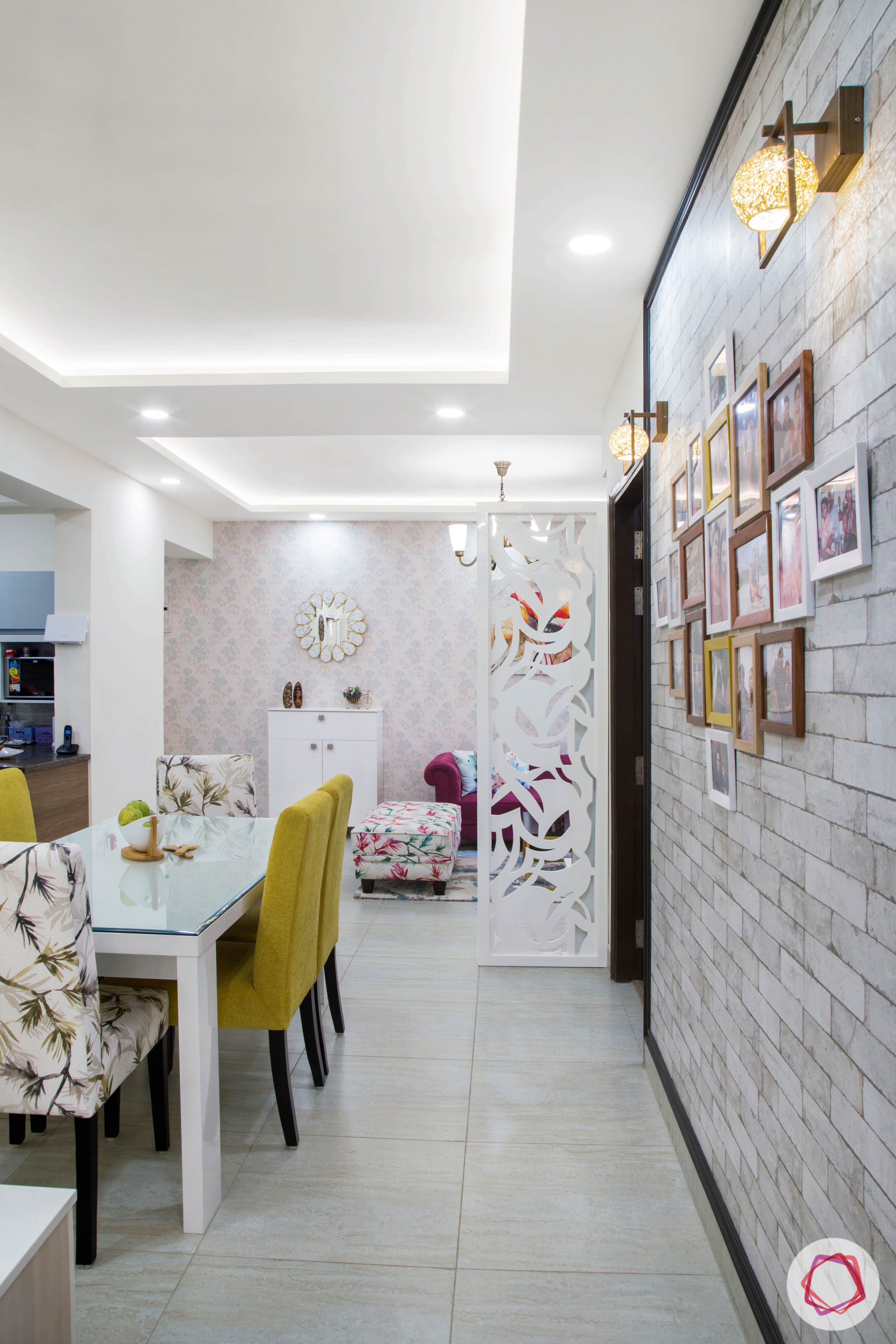 Cleo county noida_dining room with photo wall on exposed brick wallpaper