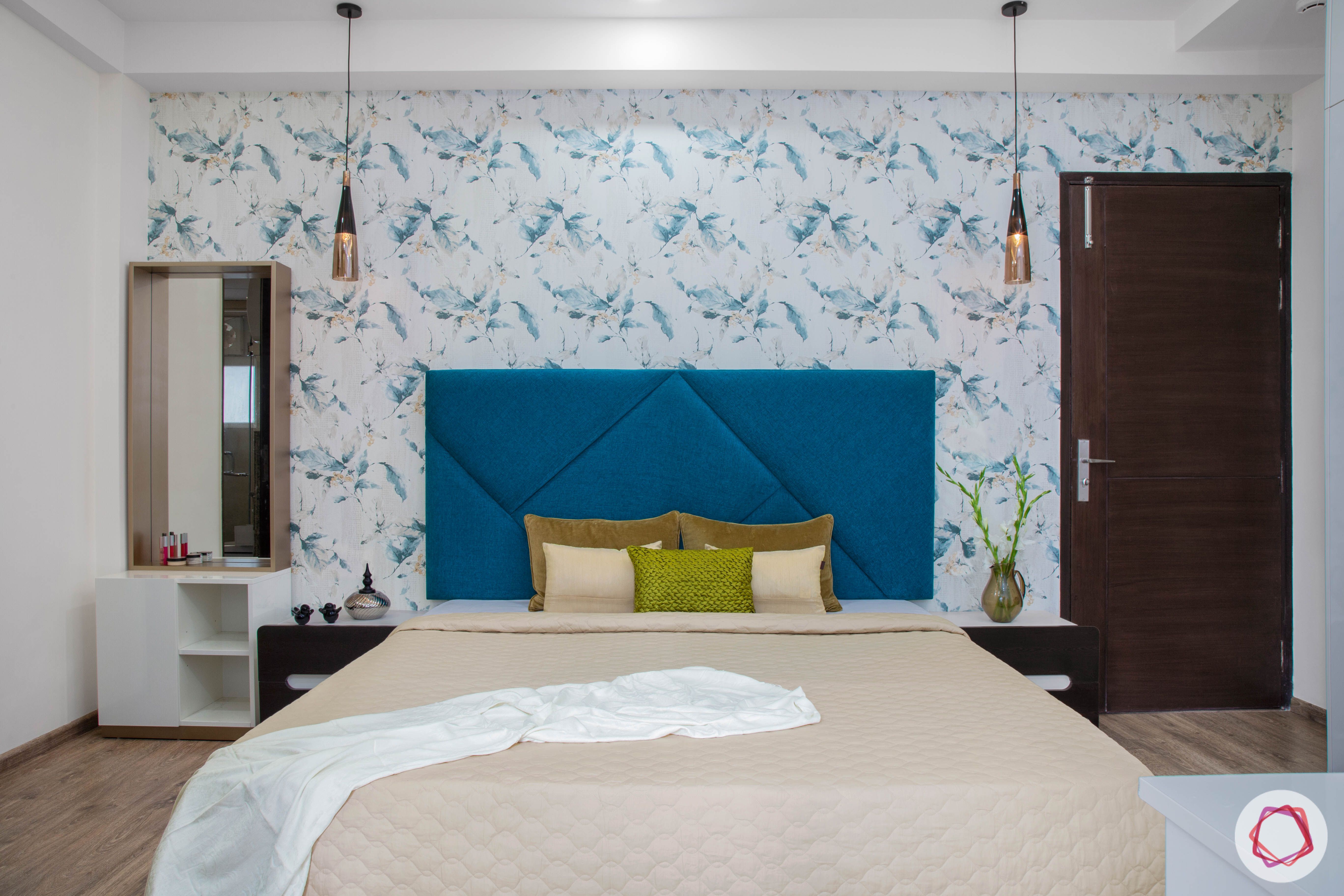 Cleo county noida_master bedroom with floral wallpaper and pendant lights