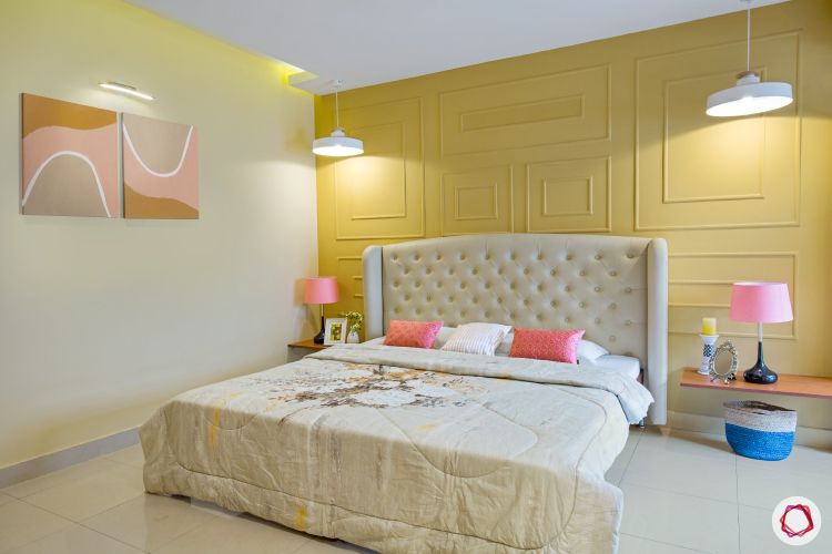 wall paint colours_yellow wall-with trims-bed with cream headboard-renovation