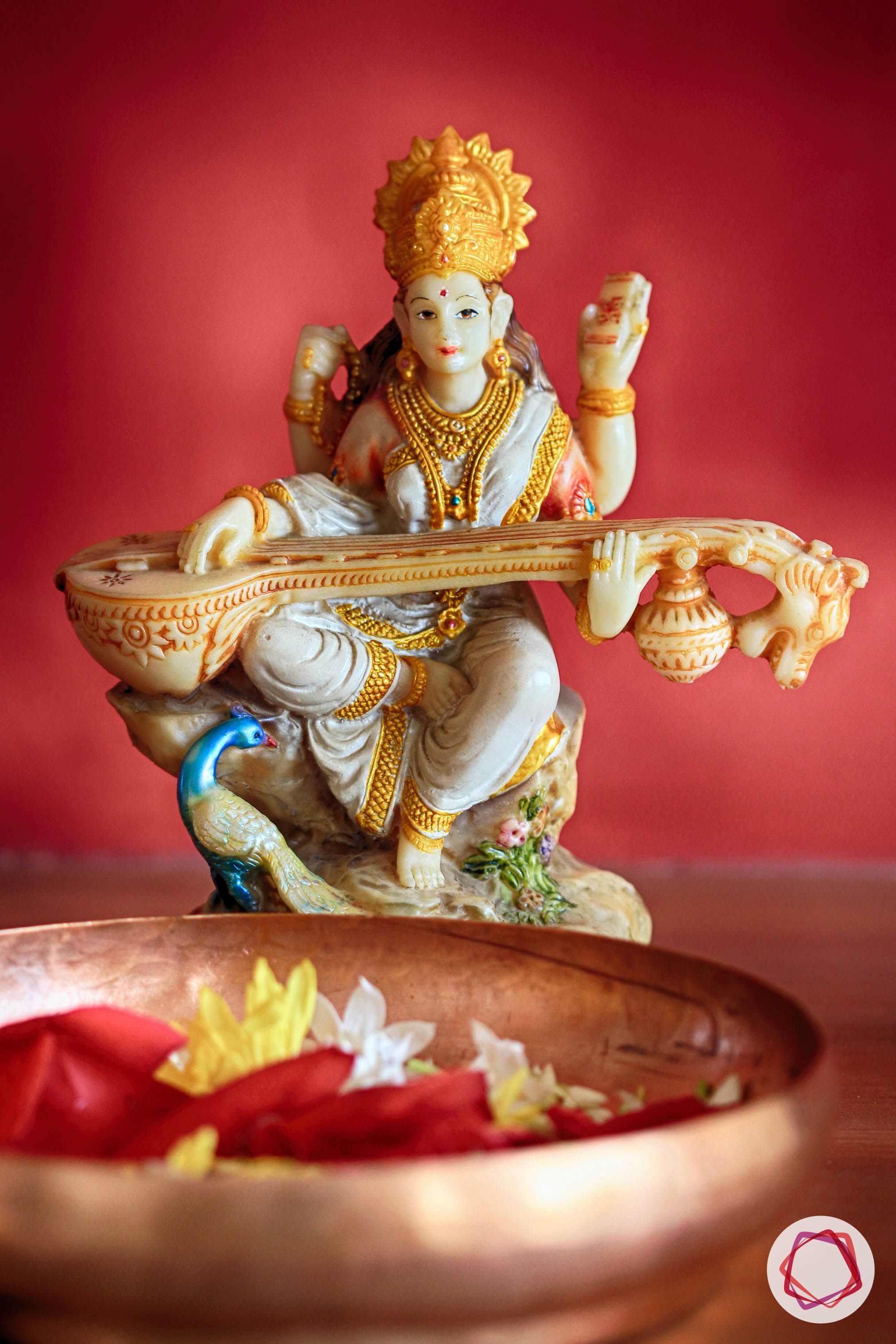 saraswati-idol brass-bowl floral-decoration