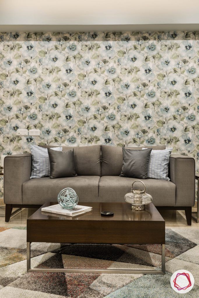 flat interior design-floral-living room-grey sofa-floral wallpaper-coffee table-accent patterned rug