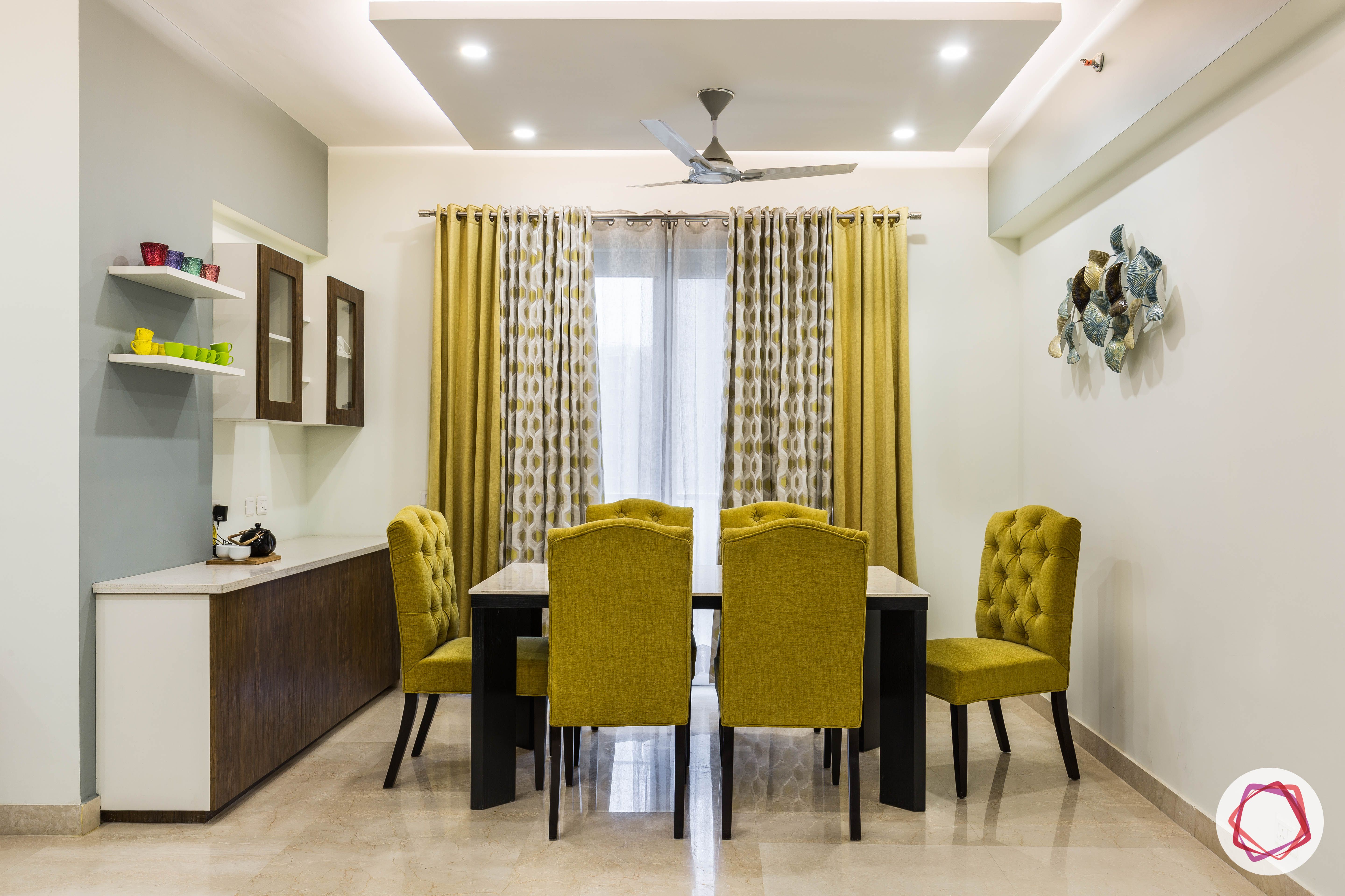 livspace-interior-dining-room-mustard-chairs-curtain-table-crockery-unit 