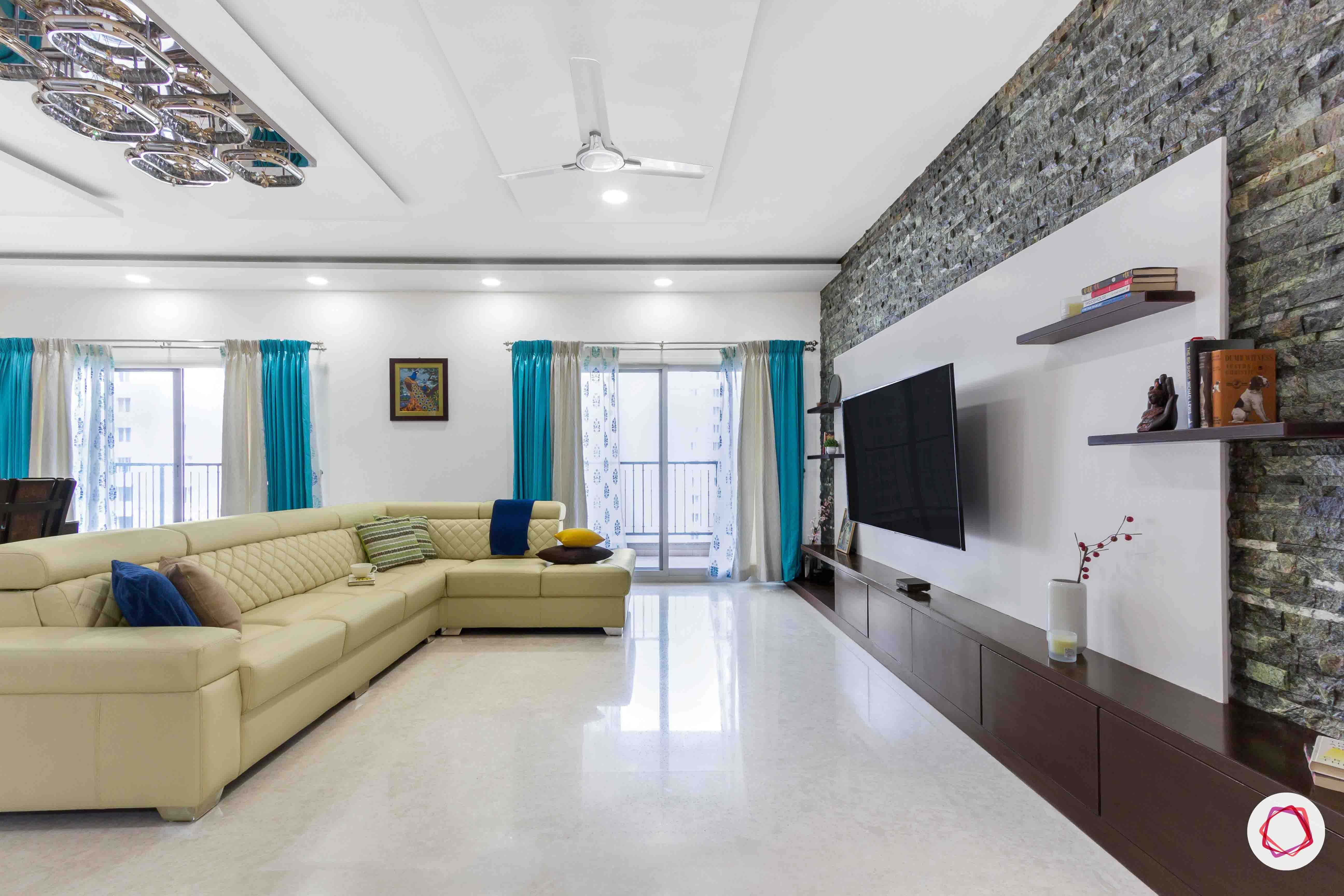 sobha forest view-l-shaped sofa-tv unit-stone wall cladding