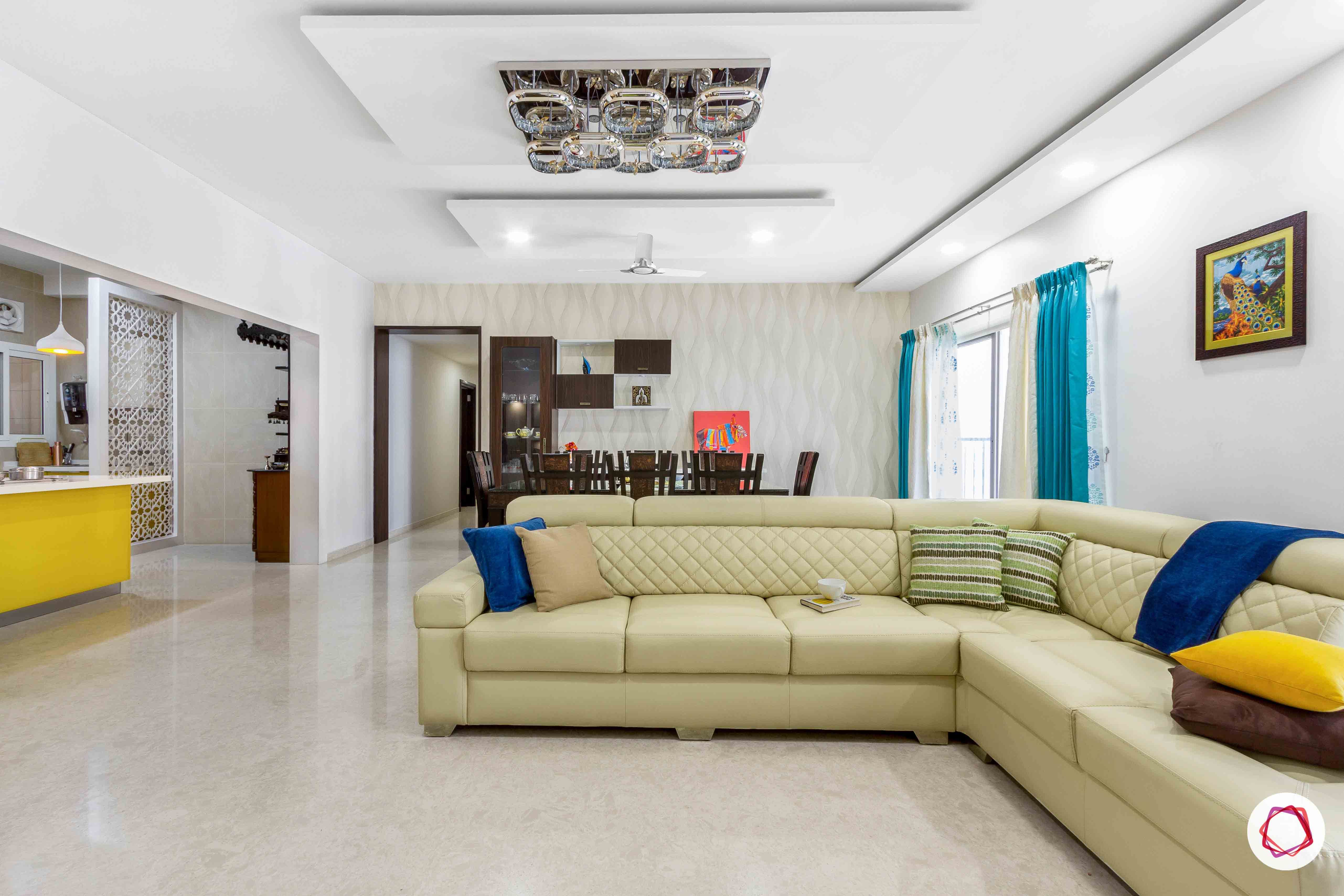 sobha forest view-living room-beige sofa-pop colour cushions-dining room