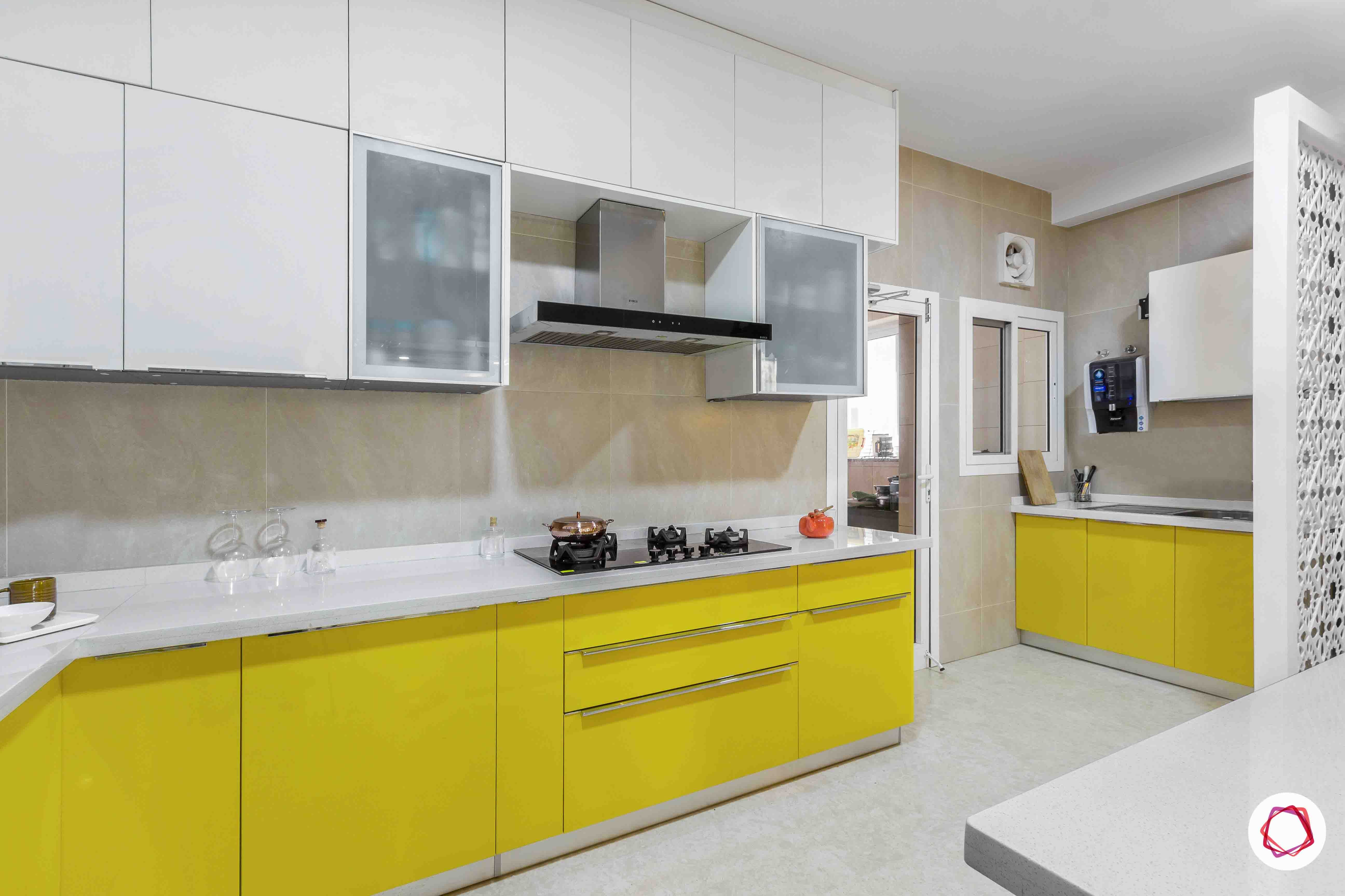 sobha forest view-modular kitchen design-quartz countertop-lofts-yellow base units-hob unit