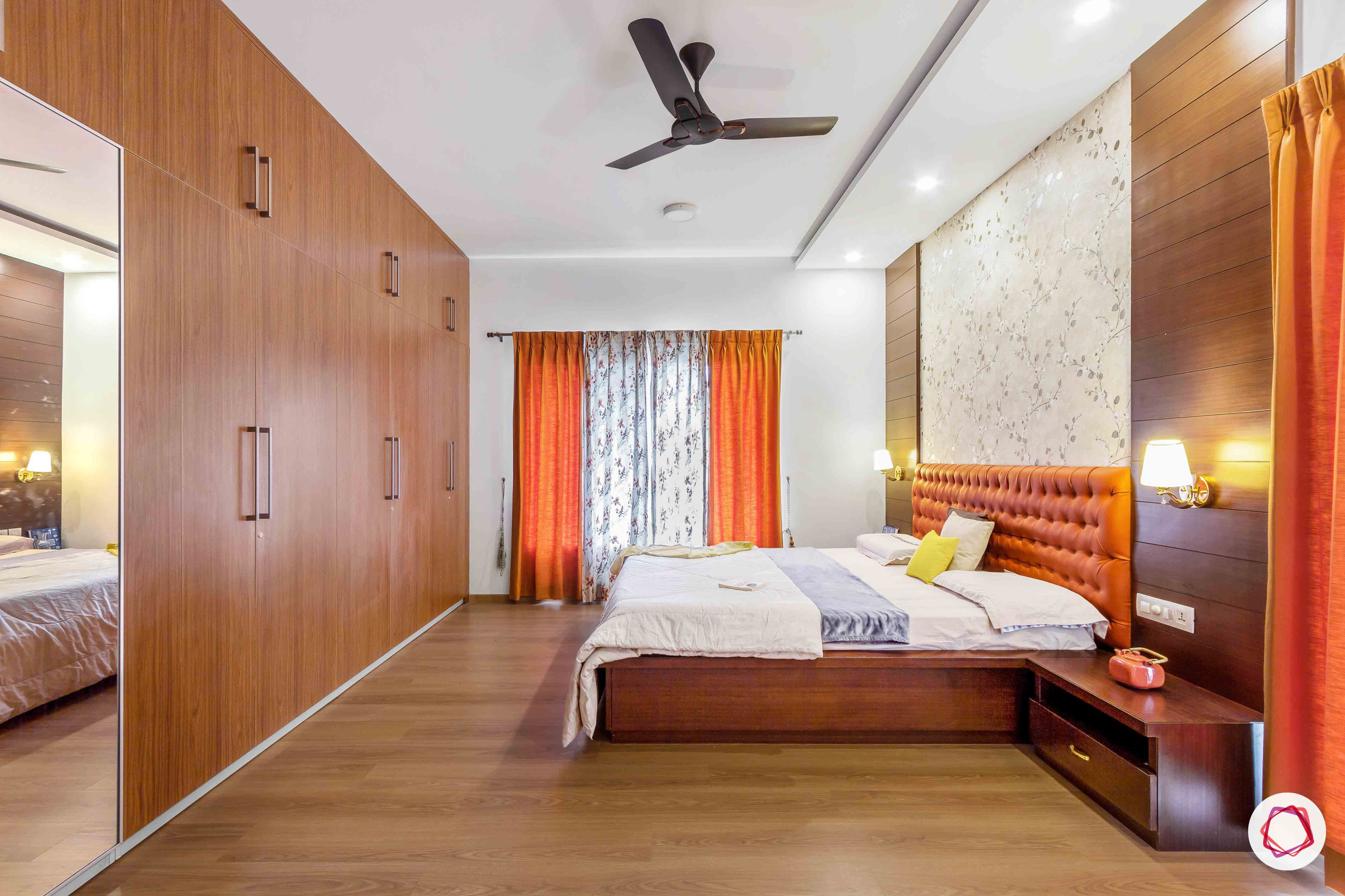 sobha forest view-master bedroom-rust orange-wooden tones-floral wallpaper