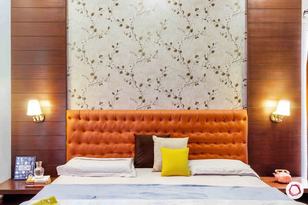 sobha forest view-master bedroom-rust orange-wooden tones-floral wallpaper-veneer panelling