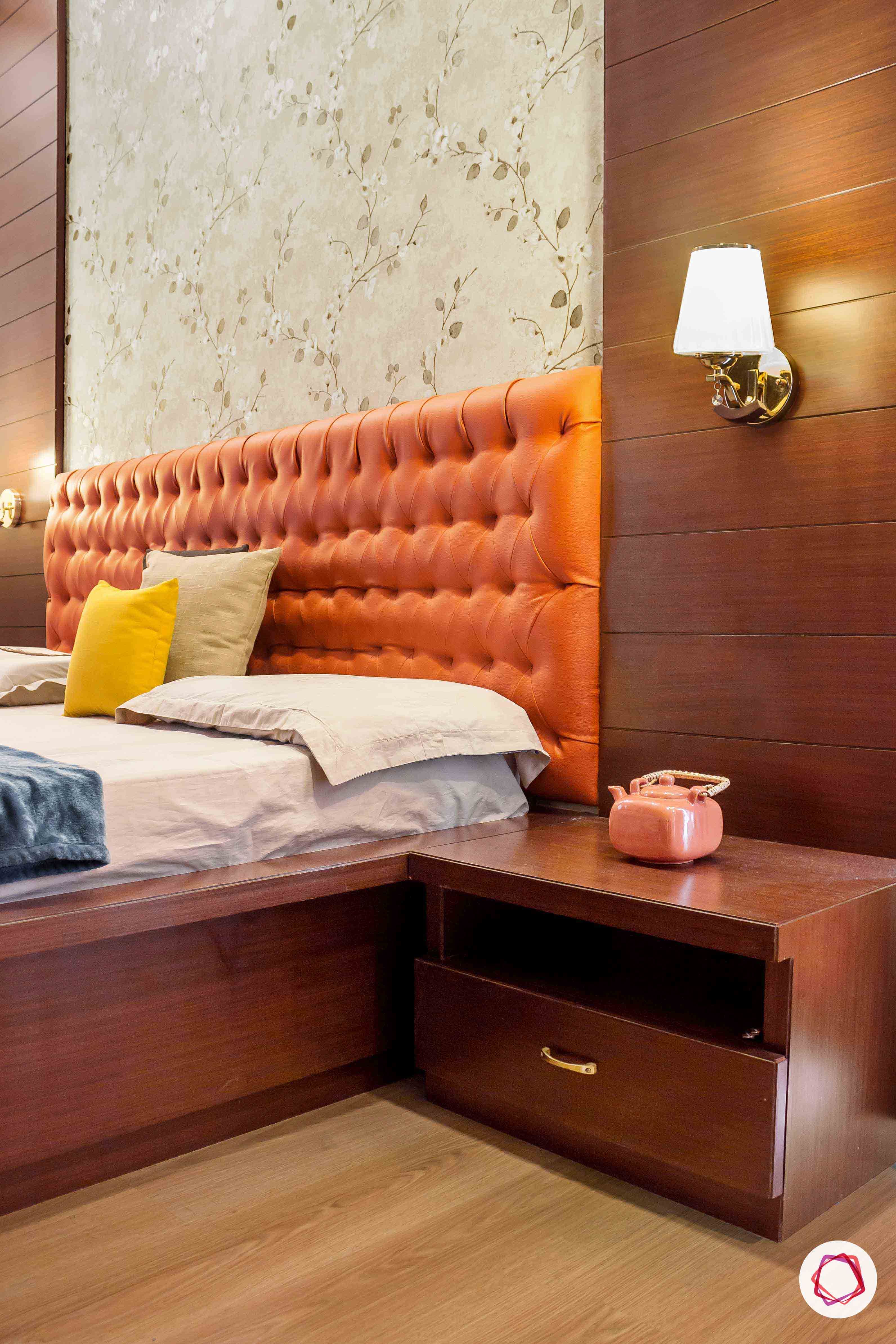 sobha forest view-master bedroom-rust orange-wooden tones-floral wallpaper-headboard-sidetable