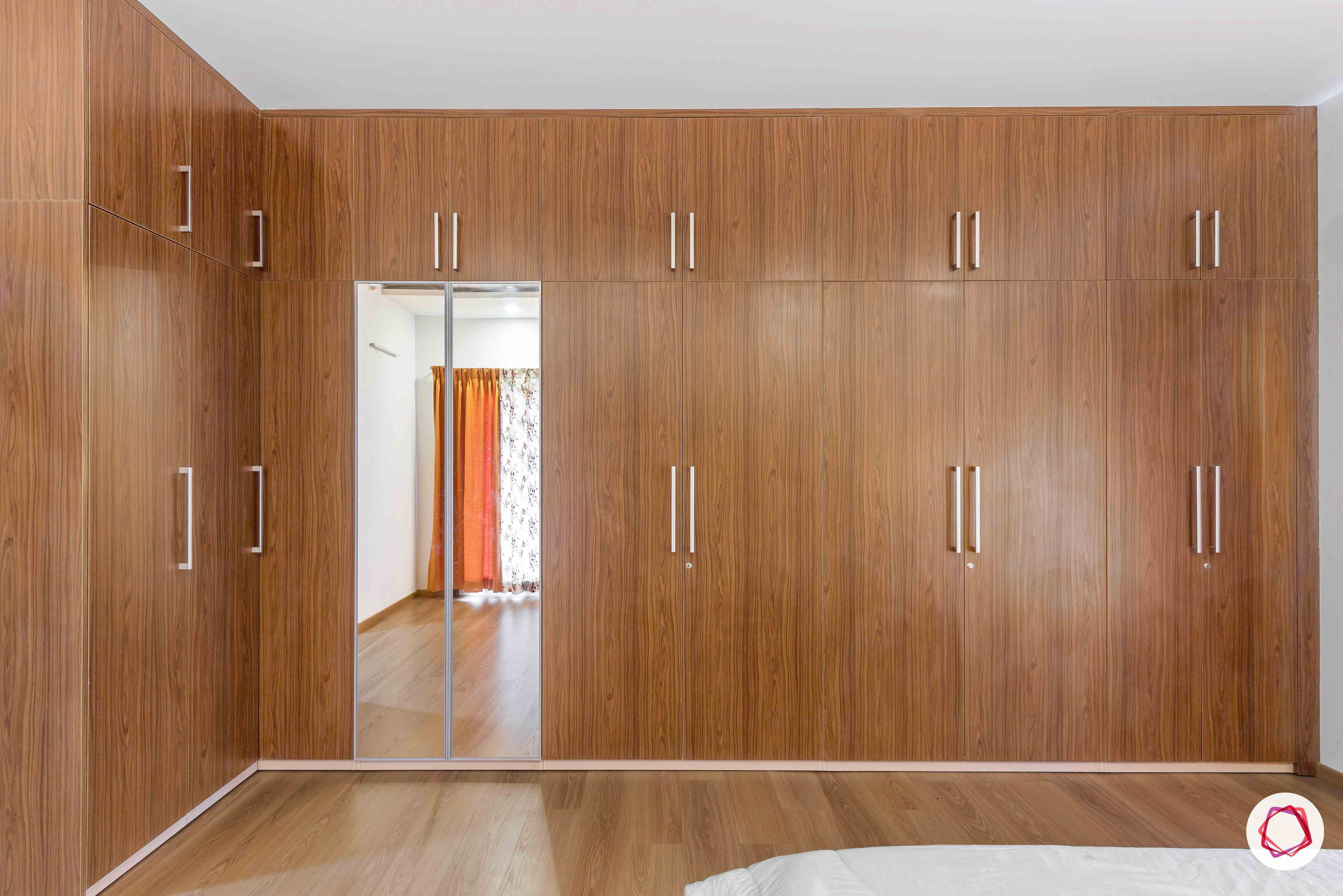 sobha forest view-master bedroom-wooden tones-swing door wardrobes-sleek handles