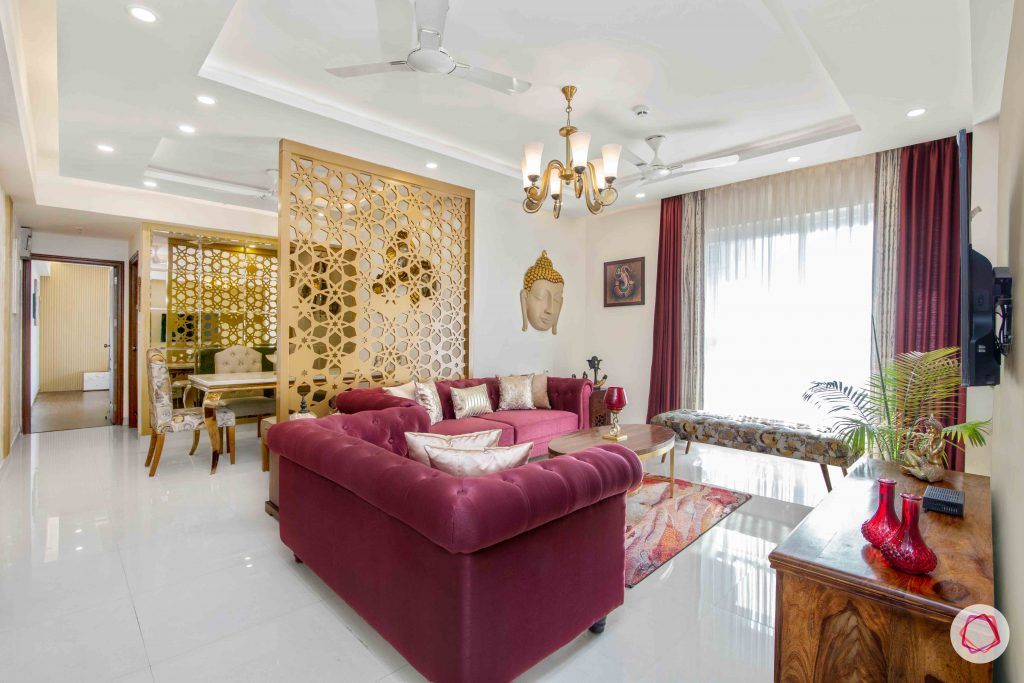 3 bedroom flat design-tufted sofa-art silk sofa-white and gold wallpaper-ethnic accent pieces