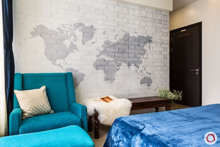 small-space-interior-design-exposed-brick-wall-white-world-map-pattern-wallpaper-designs- blue-fabric-couch-wooden-bench