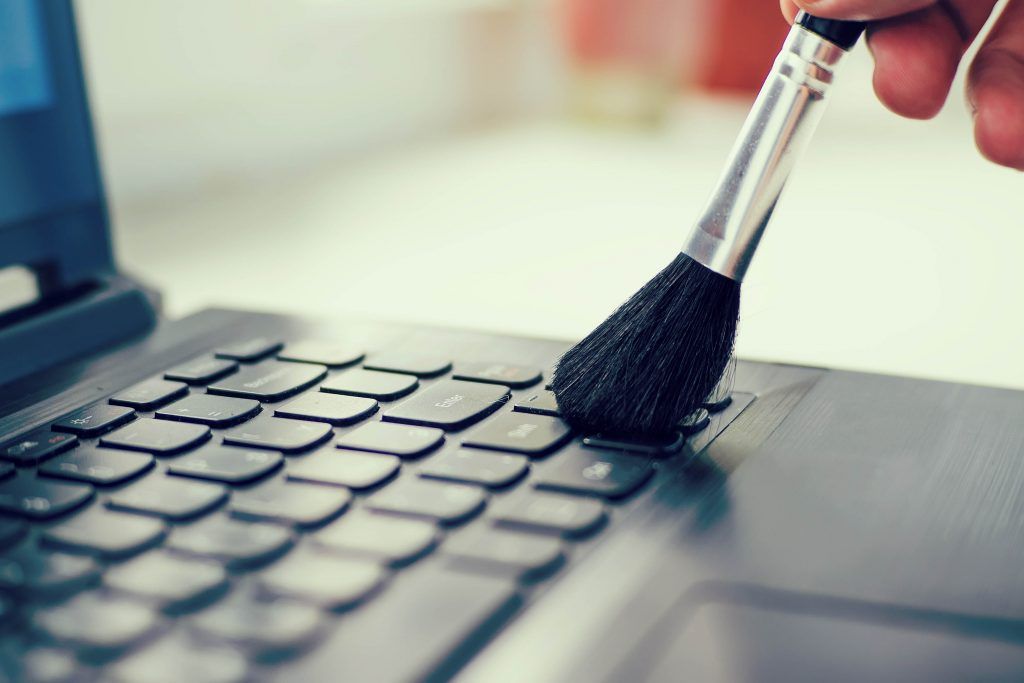 housekeeping-checklist-cleaning-computer-keyboard-dusting-brush
