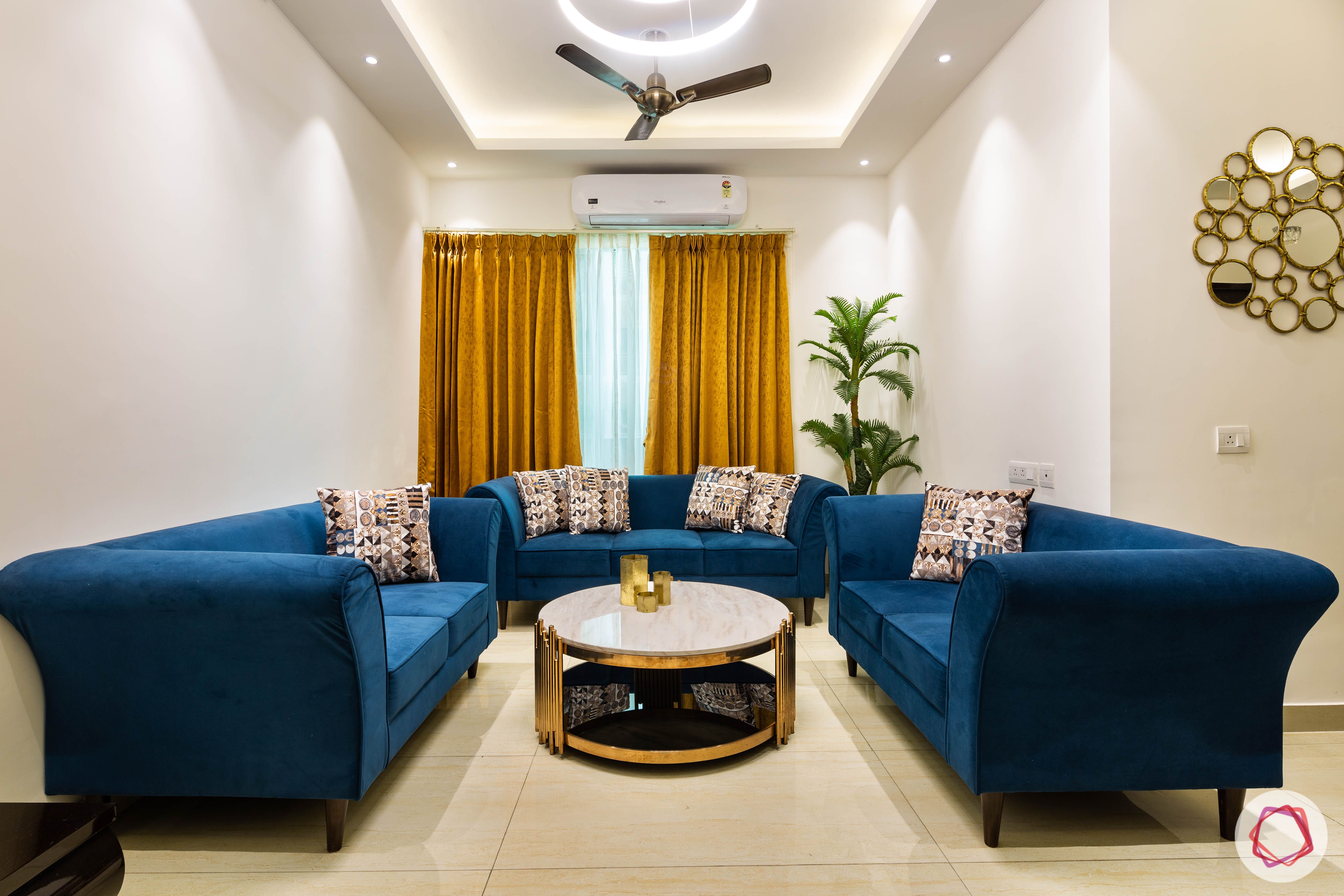 3 bhk flat-living room-entrance-blue sofas-yellow curtains