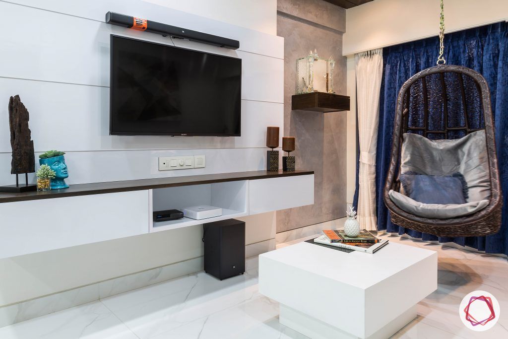 house-renovation-living-room-tv-panel-pooja-textured-wall-swing-coffee-table