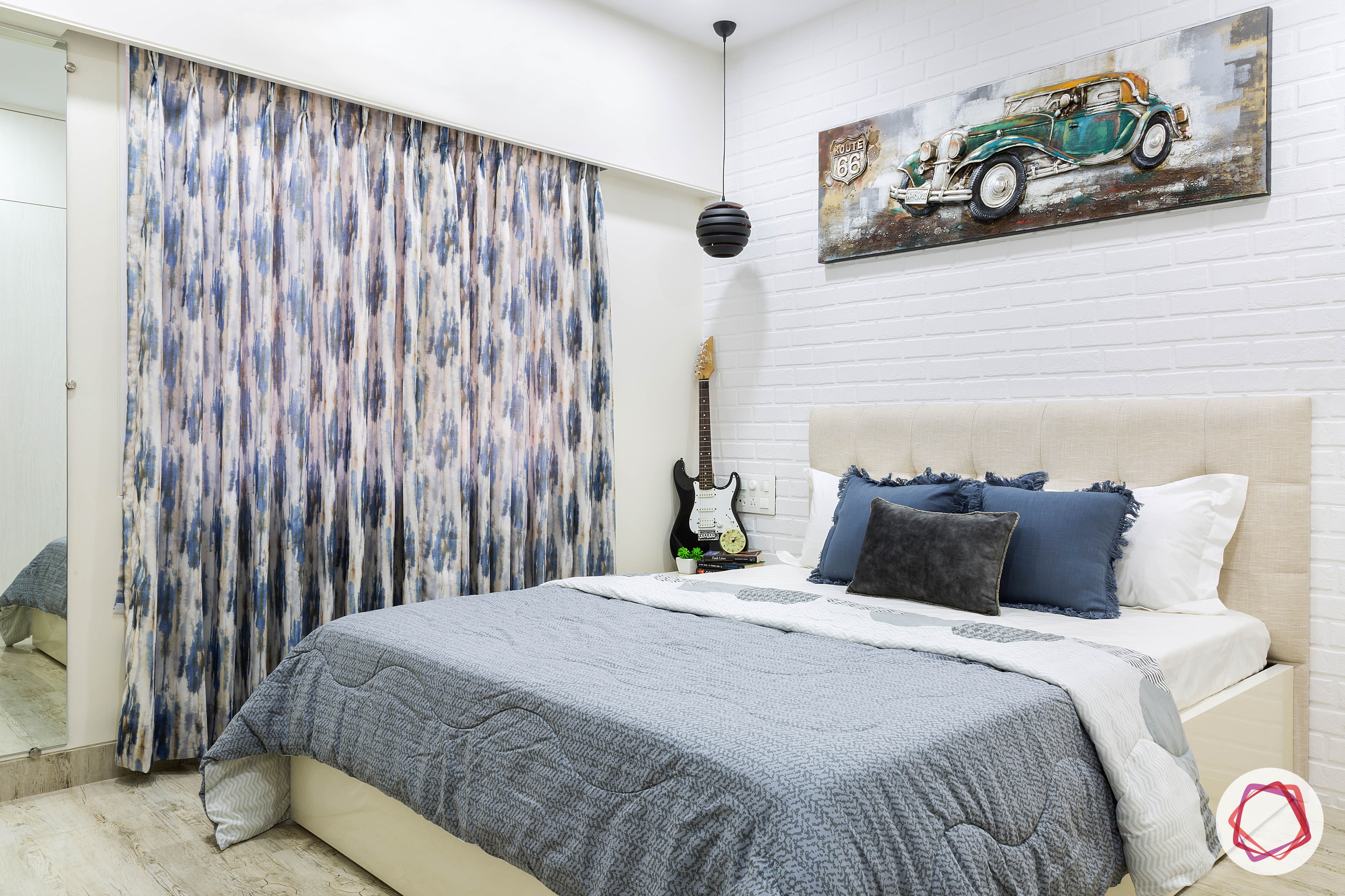 house-renovation-second-bedroom-brick-tiles-bed-beige-headboard-mirror-curtains