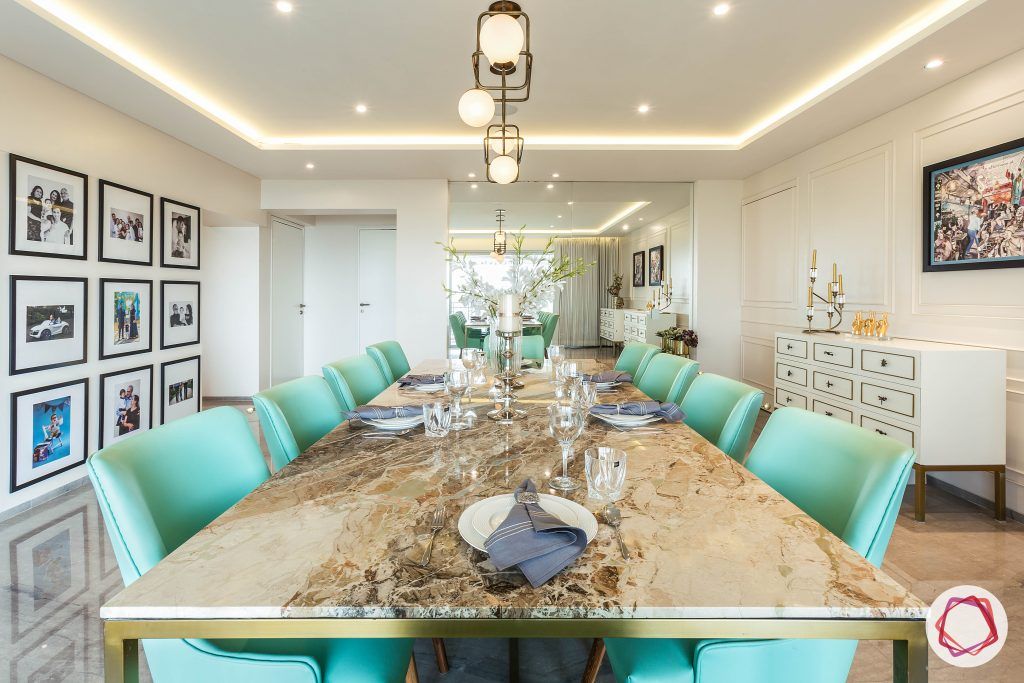 4bhk house plan-living room furniture-marble tabletop-10-seater dining set-green dining chairs-gallery wall designs-wall moulding designs