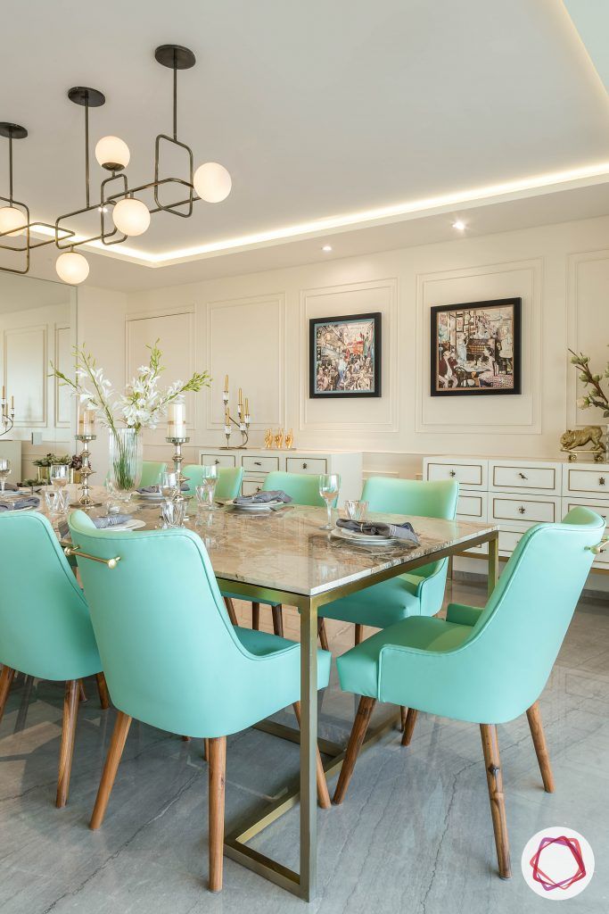 4bhk house plan-living room furniture-marble table top-green dining chairs-wall moulding designs-hite consoles-marble flooring