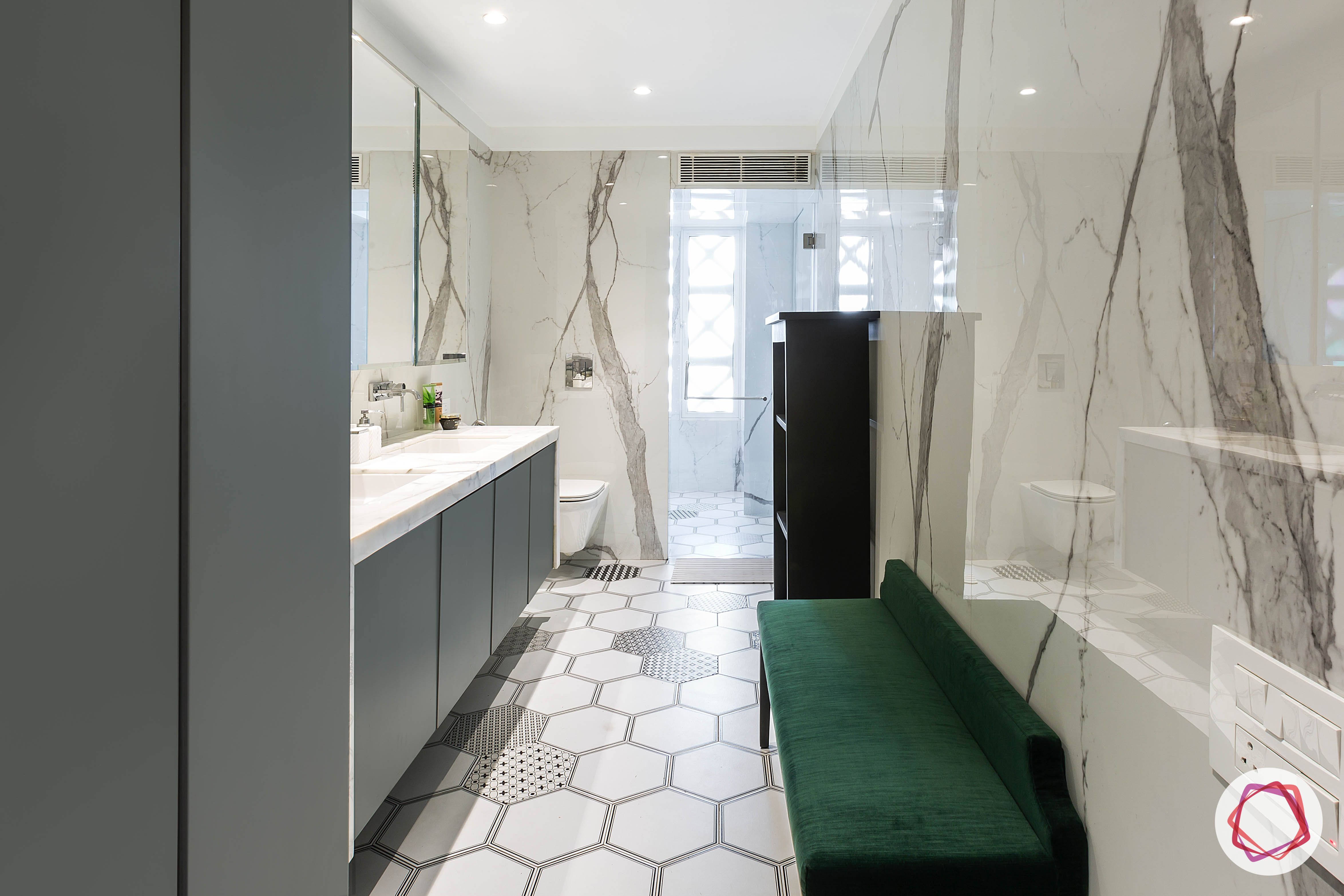 4bhk house plan-master bathroom designs-large bathroom designs-bathroom marble designs-bathroom tile designs-hexagonal tiles-bathroom seating ideas-cushioned bench designs