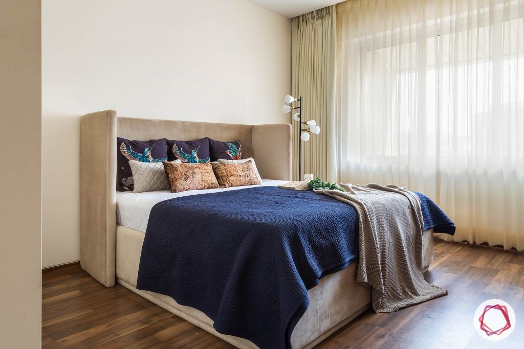 4bhk house plan-guest room designs-upholstered bed-wooden flooring-sheer curtains