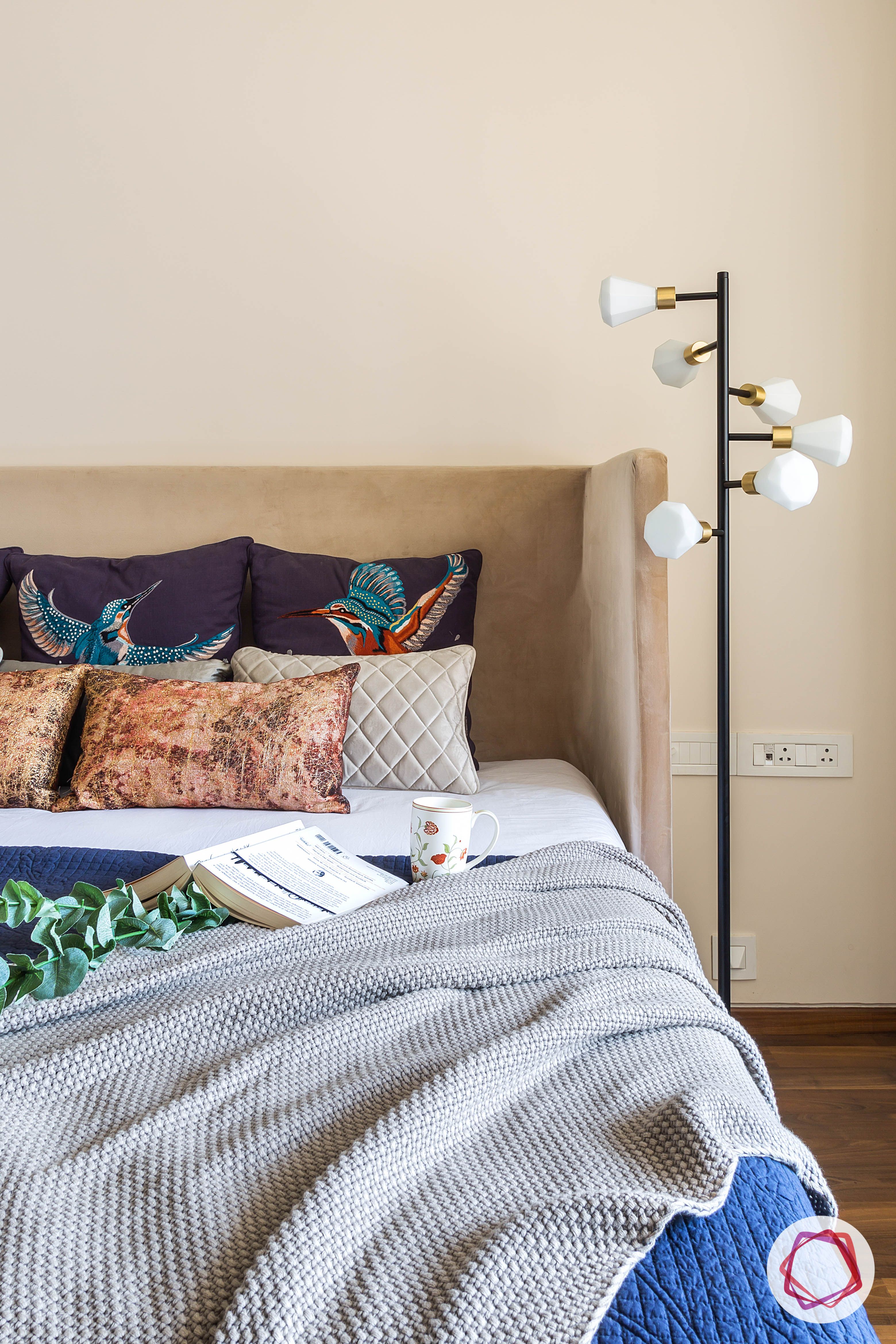 4bhk house plan-guest room designs-upholstered bed-wooden flooring-floor lamp-industrial lights