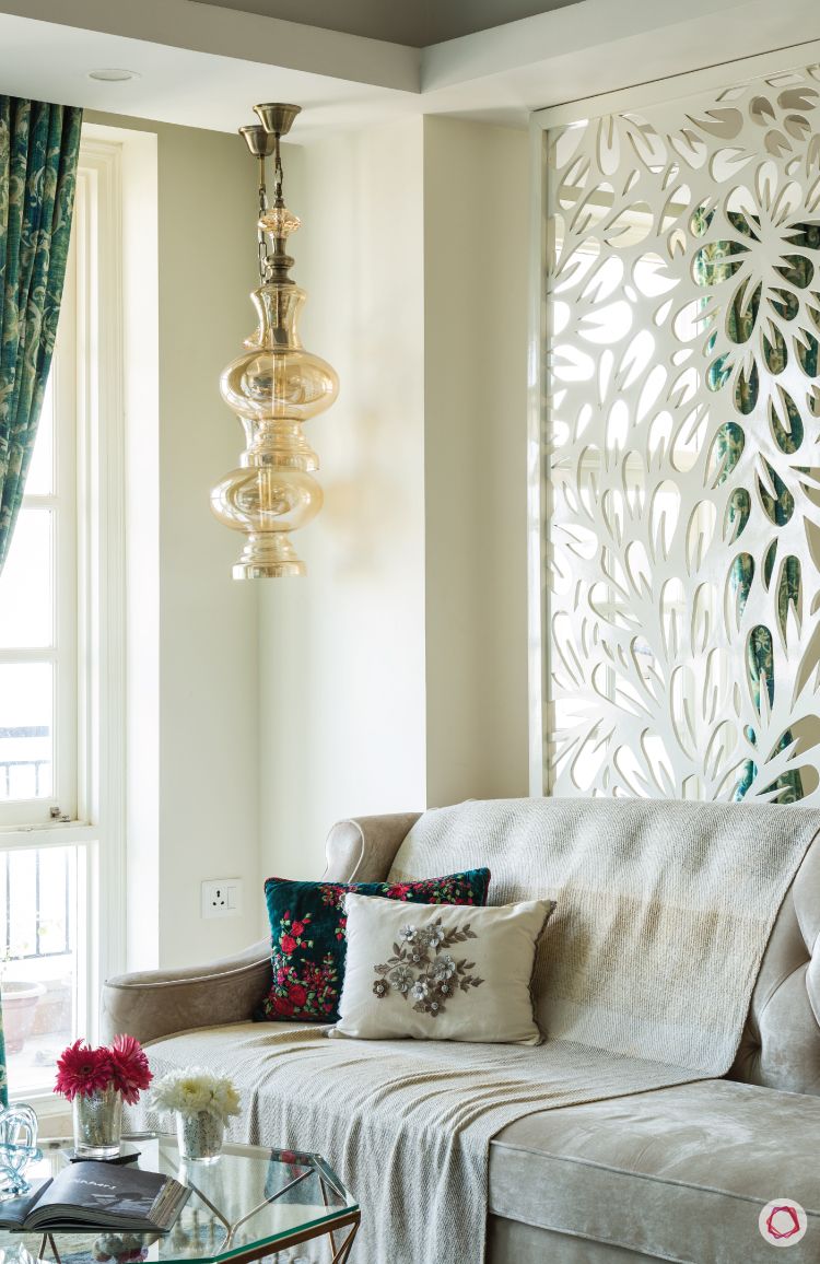flat-in-faridabad-living-room-modern-sofa-pendant-light-throw-pillows-beige
